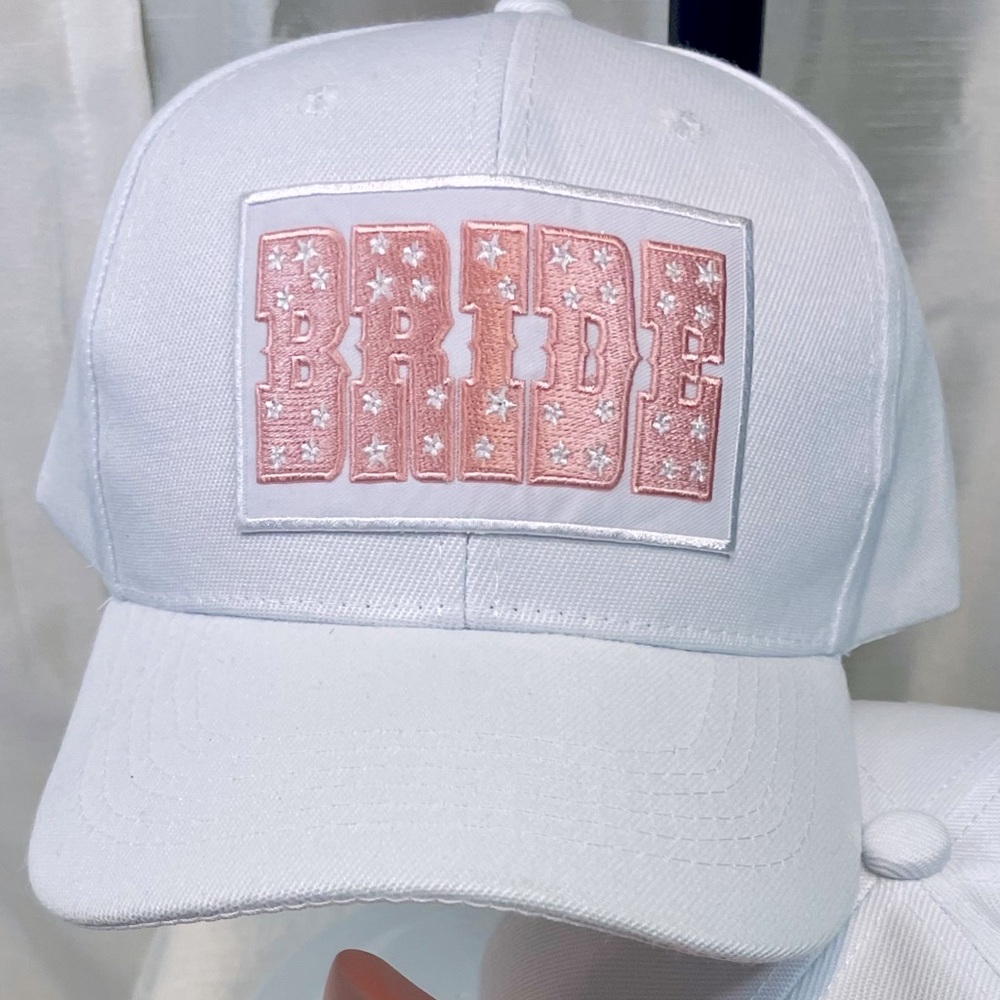 “Blushing Bride” White cotton ball cap with pink satin bow on the back